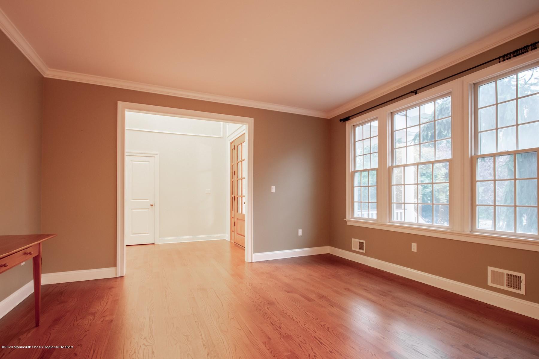 63 River Road Rumson, NJ 07760 - Photo 17 of 37 an empty room with wooden floor and windows