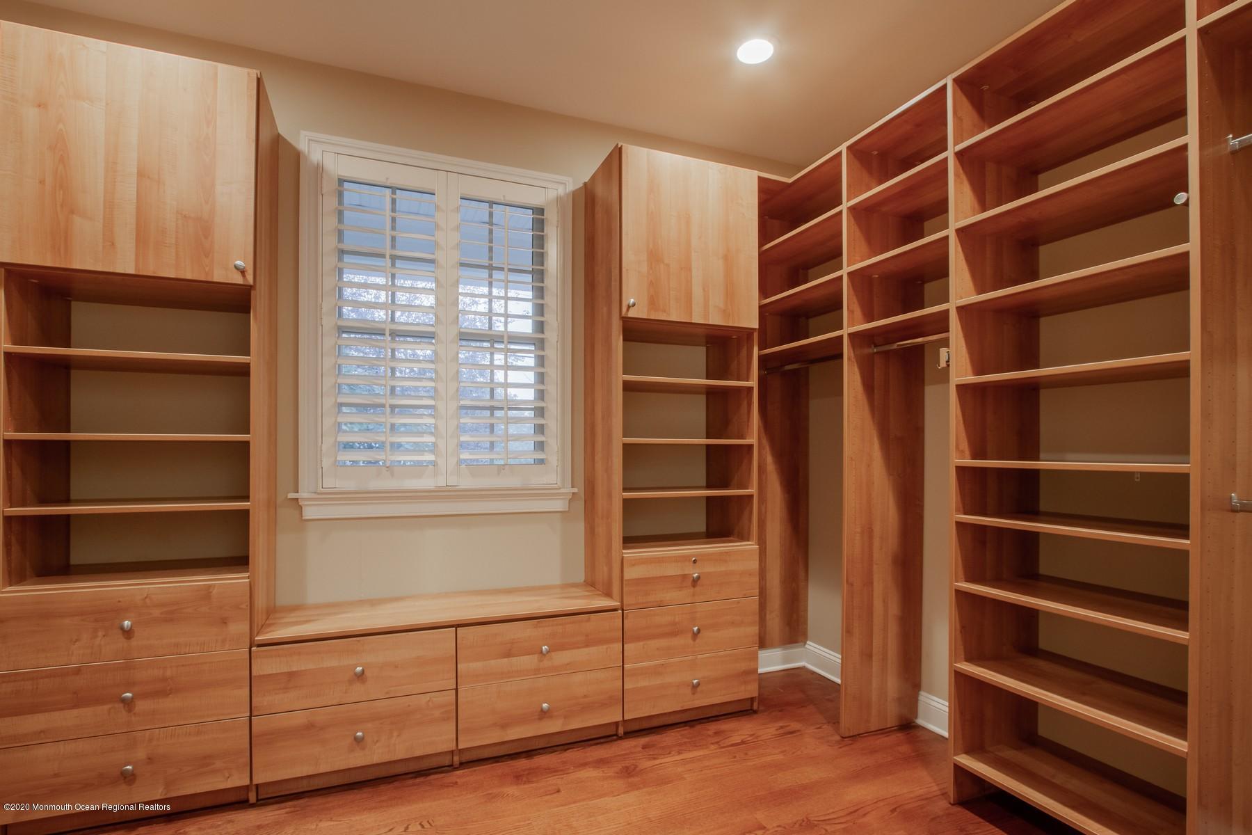 63 River Road Rumson, NJ 07760 - Photo 23 of 37 a view of walk in closet with empty racks
