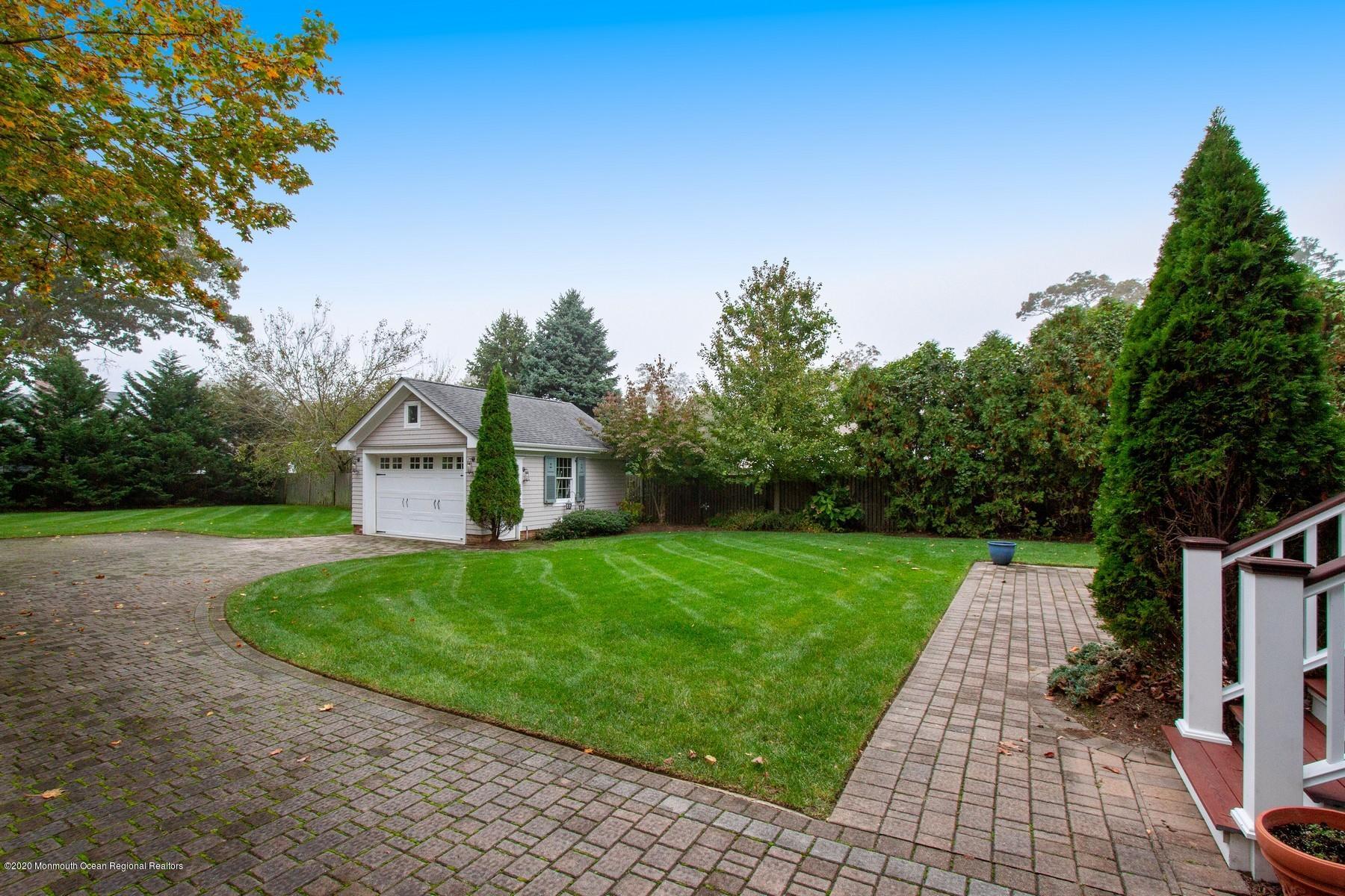 63 River Road Rumson, NJ 07760 - Photo 36 of 37 a front view of a house with yard