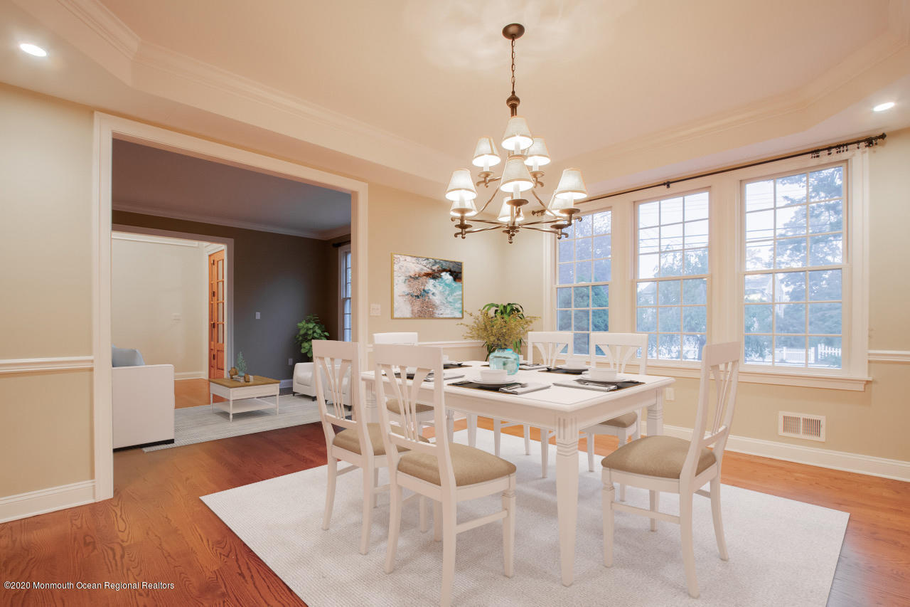 63 River Road Rumson, NJ 07760 - Photo 5 of 37 a view of a dining room with furniture wooden floor and chandelier