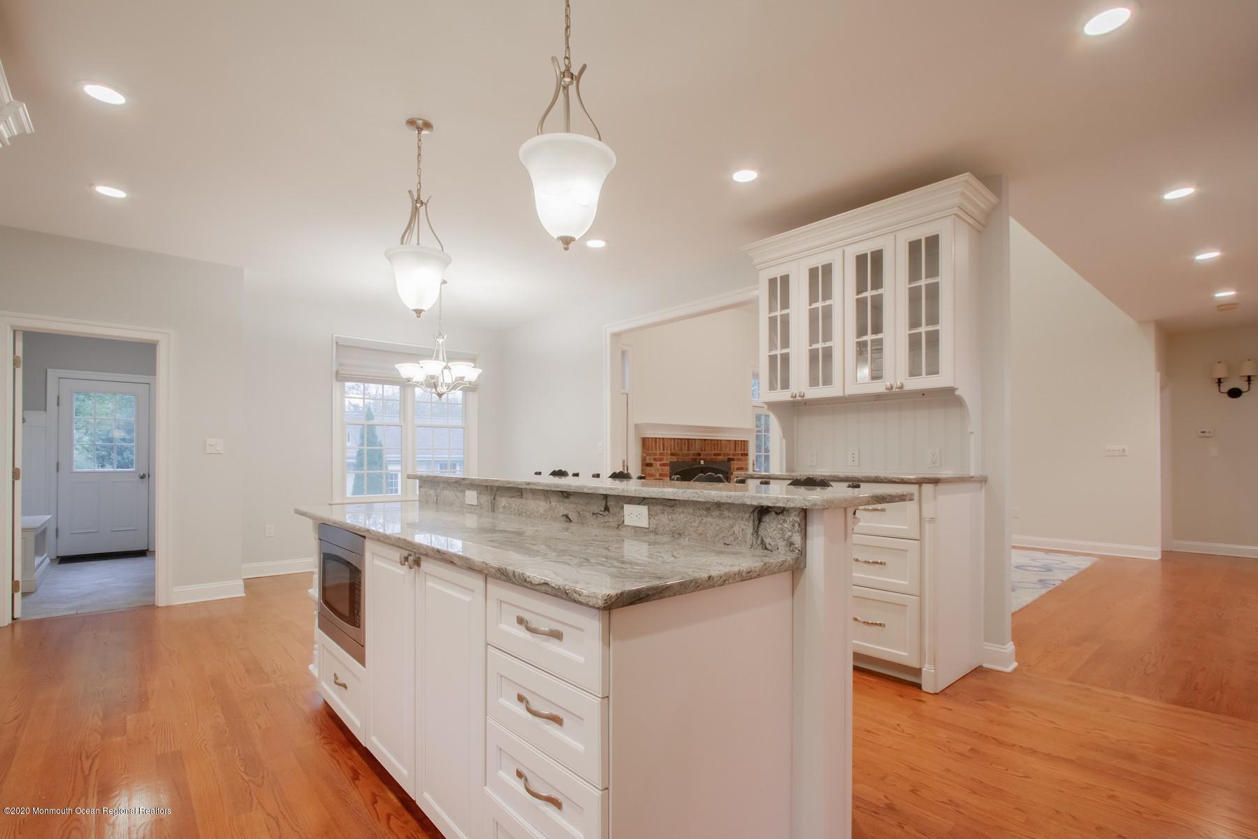 63 River Road Rumson, NJ 07760 - Photo 10 of 37 a kitchen with stainless steel appliances granite countertop a stove and a sink
