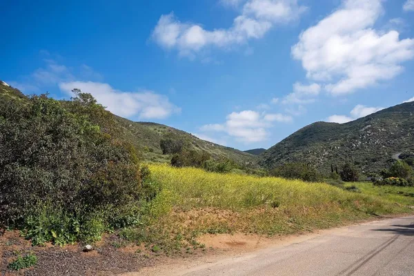 a view of a lake with mountains in the background