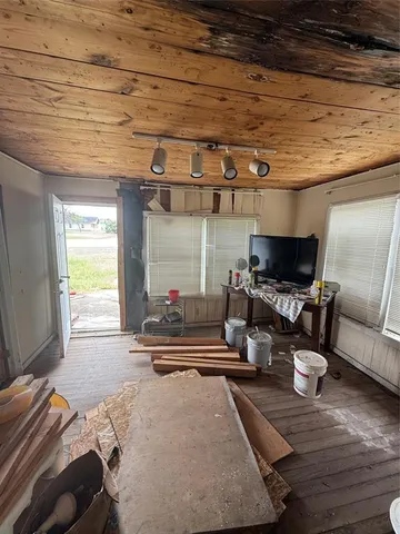 a room with furniture and a wooden floor