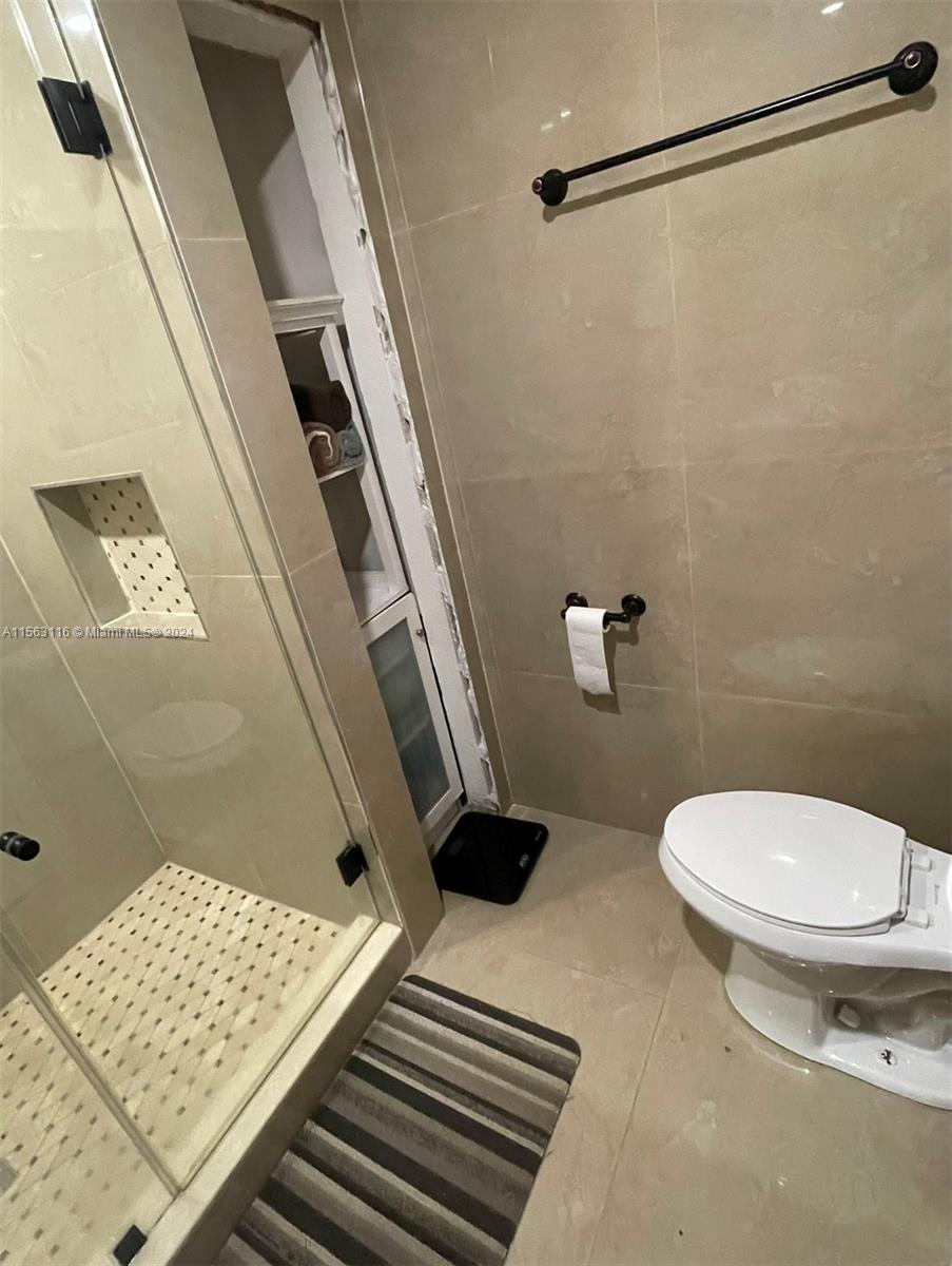 11810 Southwest 176th Street Miami, FL 33177 - Photo 11 of 15 a bathroom with a toilet and a shower