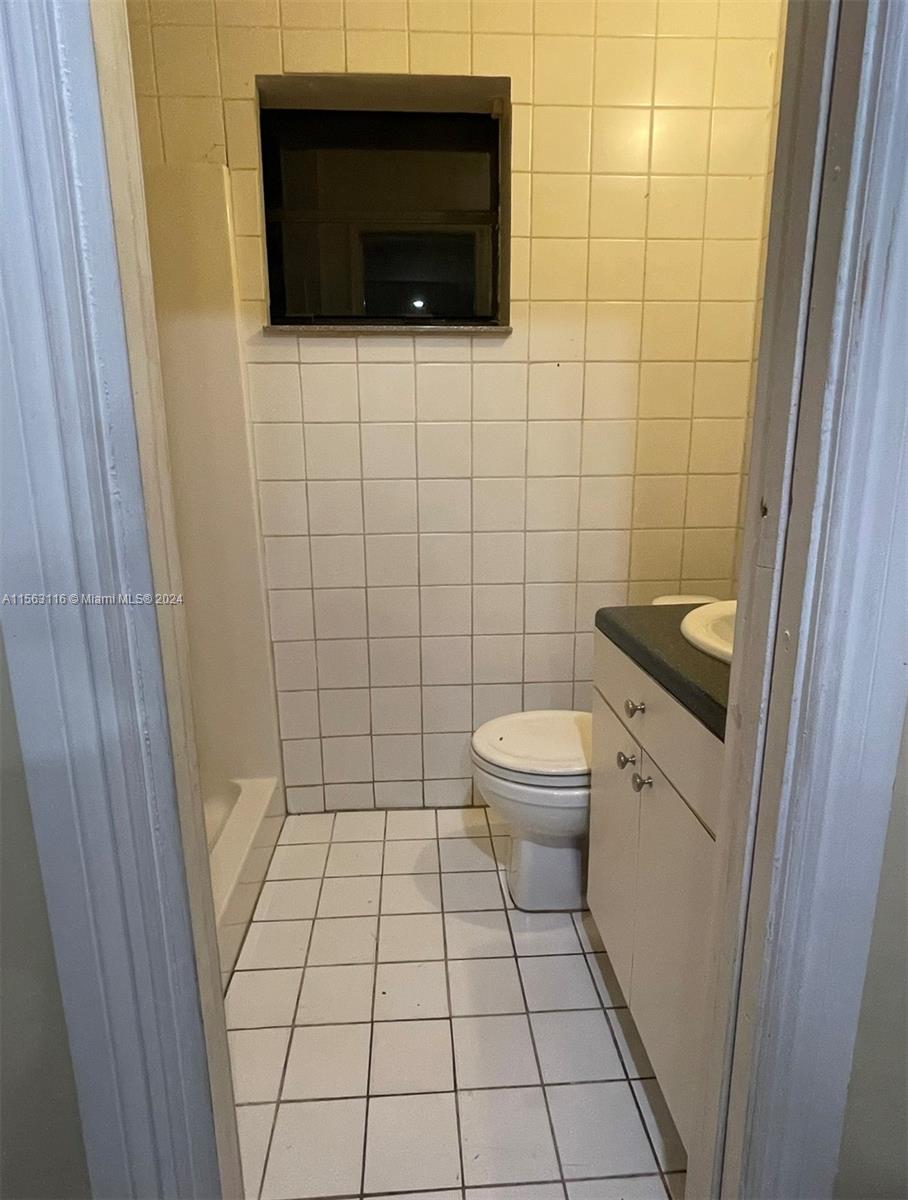11810 Southwest 176th Street Miami, FL 33177 - Photo 13 of 15 a bathroom with a toilet and a shower