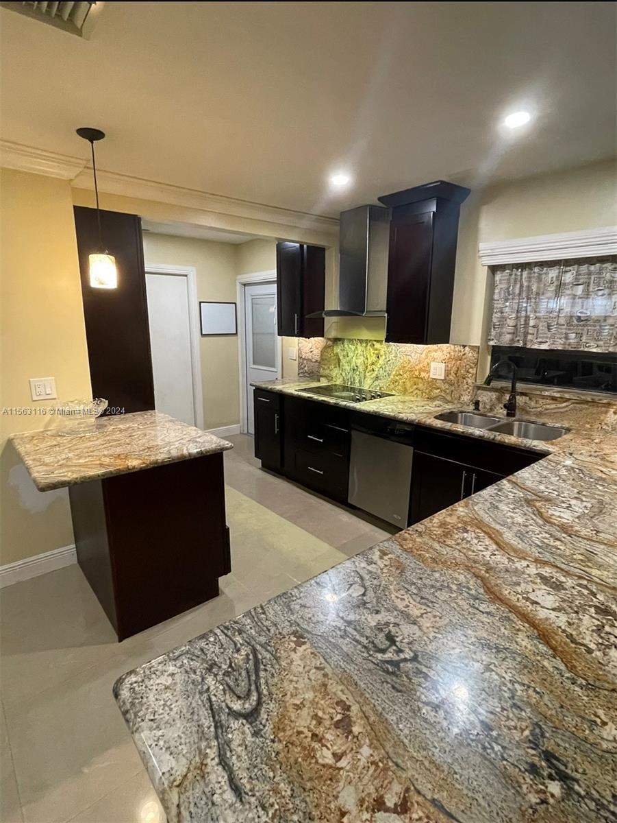 11810 Southwest 176th Street Miami, FL 33177 - Photo 2 of 15 a large kitchen with stainless steel appliances kitchen island granite countertop a sink and cabinets
