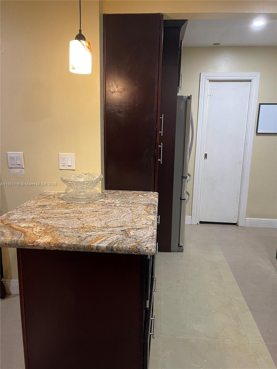 11810 Southwest 176th Street Miami, FL 33177 - Photo 5 of 15 a view of kitchen island a granite counter top