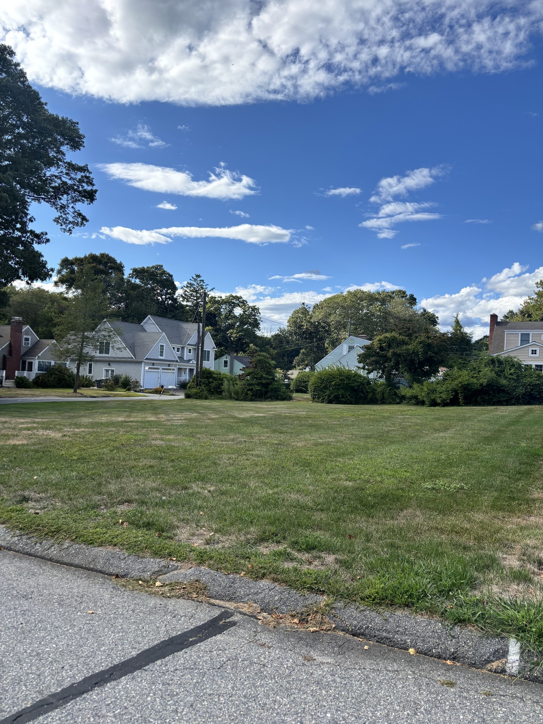 61 Whitecap Road East Lyme, CT 06357 - Photo 2 of 6 a view of a big yard with lots of green space and mountain view