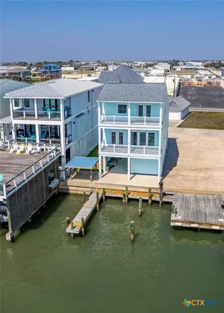 a view of a house with pool table and chairs