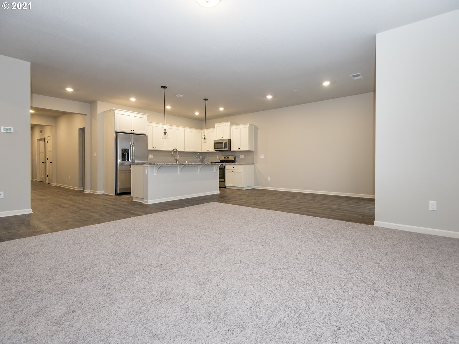 3712 South 42nd Place Ridgefield, WA 98642 - Photo 15 of 29 a view of a kitchen with a sink and a refrigerator