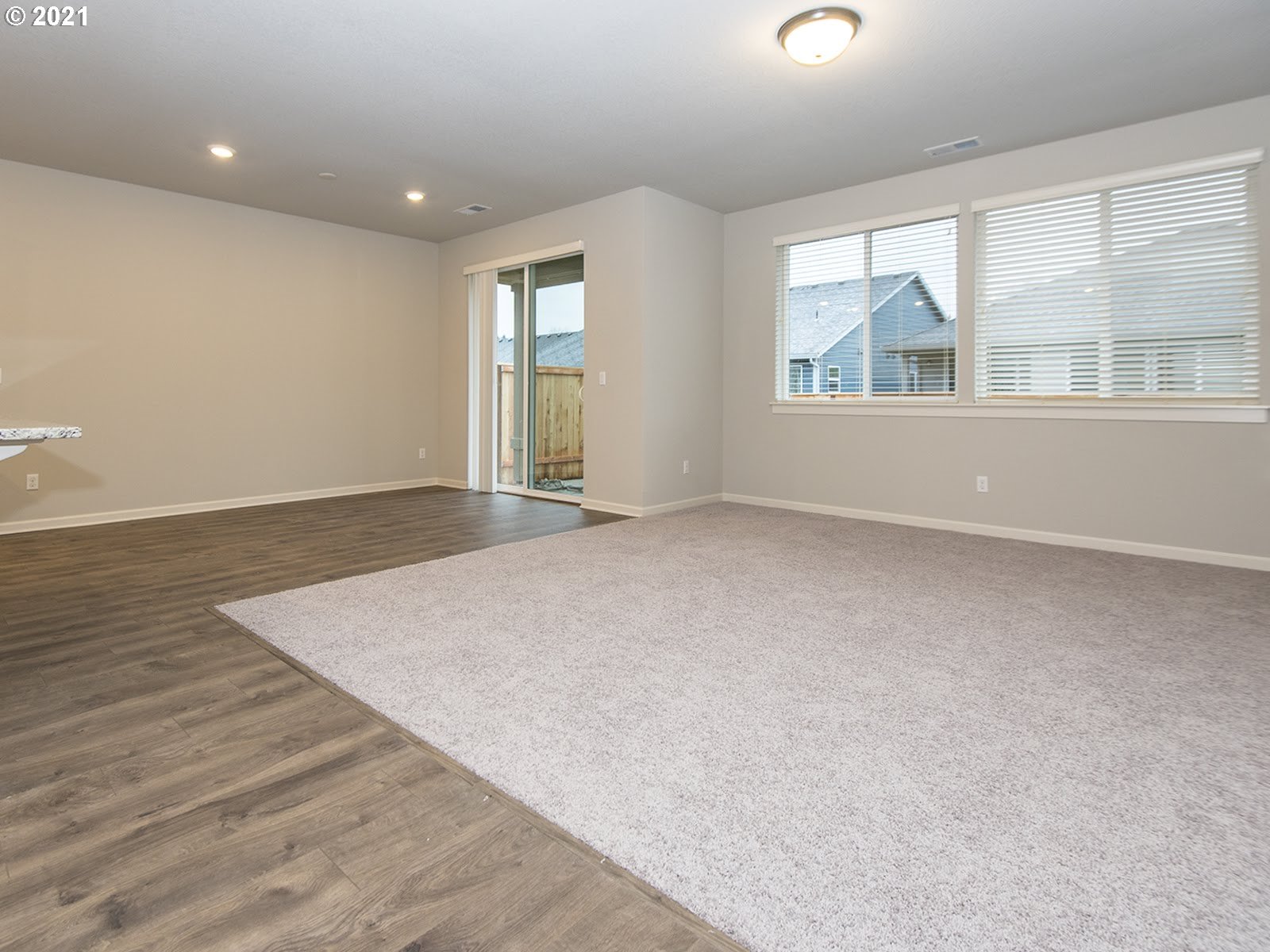 3712 South 42nd Place Ridgefield, WA 98642 - Photo 16 of 29 an empty room with wooden floor and windows