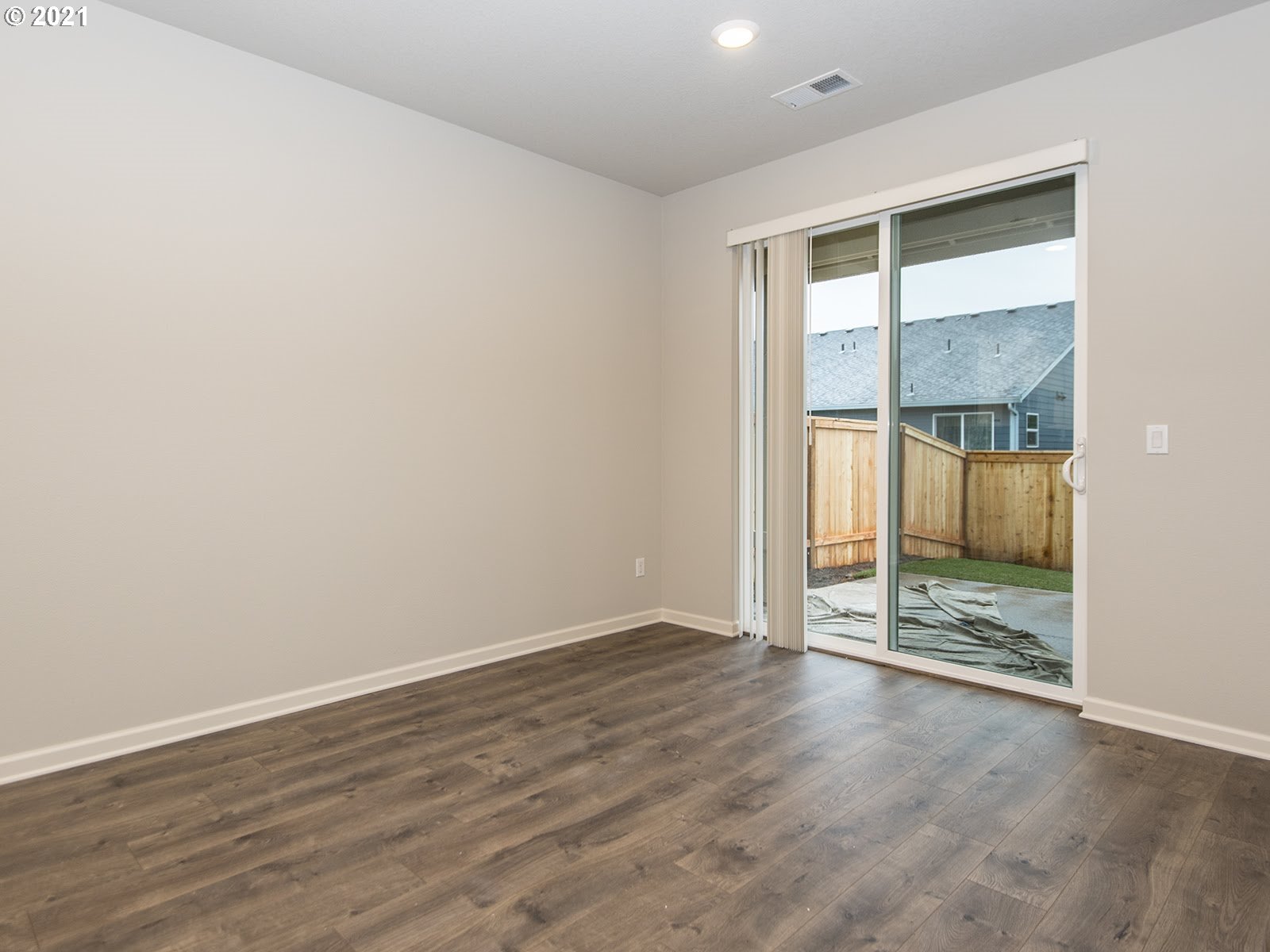 3712 South 42nd Place Ridgefield, WA 98642 - Photo 17 of 29 an empty room with wooden floor and windows