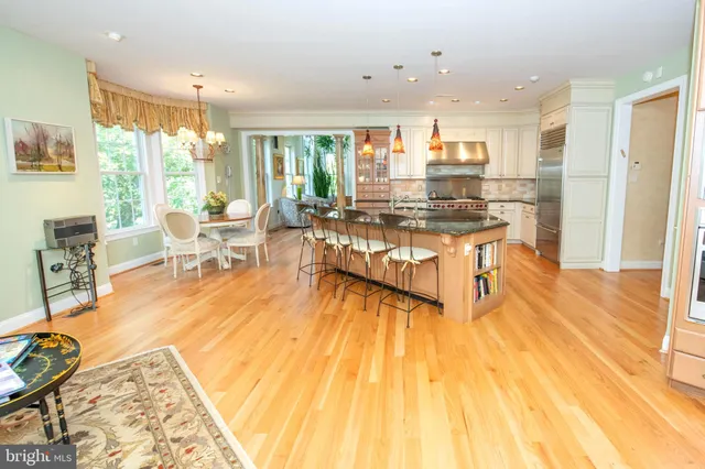a living room with a table or chairs and a wooden floor