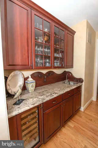 a living room with furniture and a book shelf