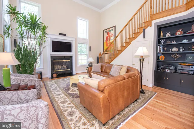a spacious bedroom with a bed and chandelier