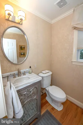 a living room with bookshelf a book shelf and a shelf
