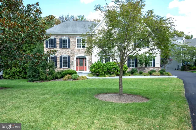 a view of a bedroom with wooden floor and stairs