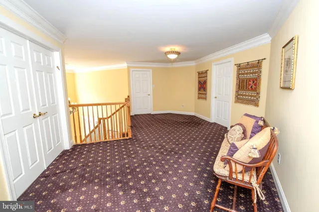 a bedroom with a bed and a book shelf