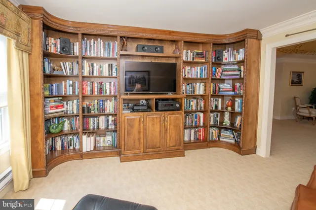 a room with a book shelf and a book shelf