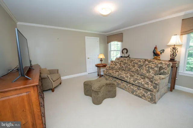 a view of balcony with furniture and wooden floor