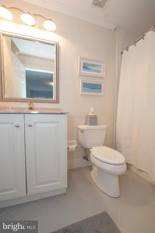 a view of green field with trees in the background