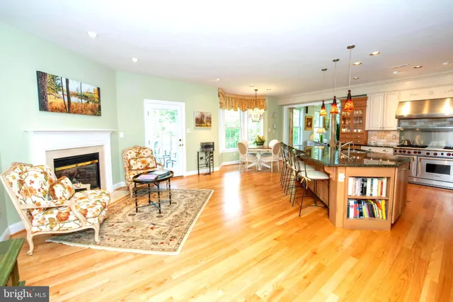 a kitchen with stainless steel appliances granite countertop a stove a refrigerator and a stove