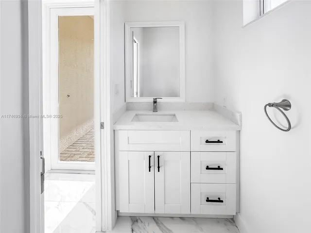 a kitchen with stainless steel appliances a refrigerator and cabinets