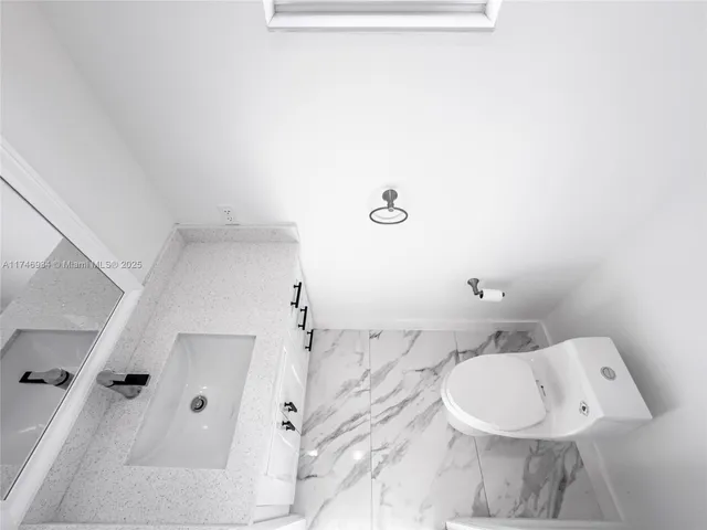 a view of a room that has a window in it