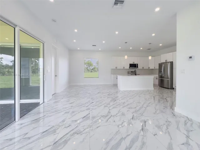 a view of an empty room and window