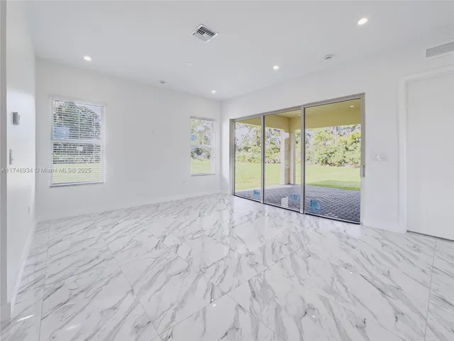 a bathroom with a sink vanity and mirror