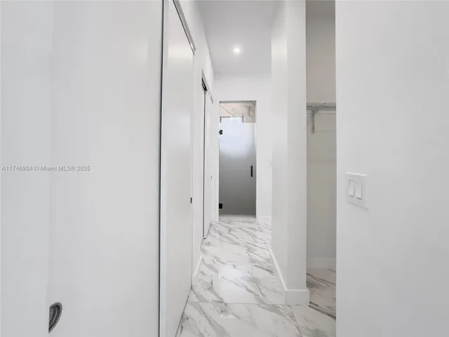 a view of a balcony with wooden floor and windows
