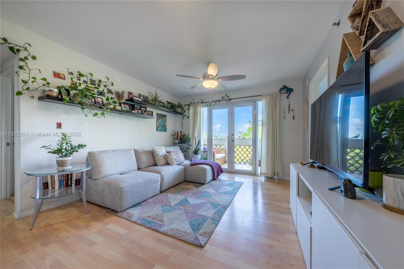 227 Michigan Avenue, Unit 305 Miami Beach, FL 33139 - Photo 1 of 20 a living room with furniture and a large window