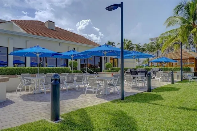 a patio with a table and chairs