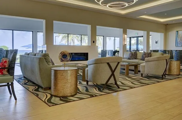 a living room with furniture and a table