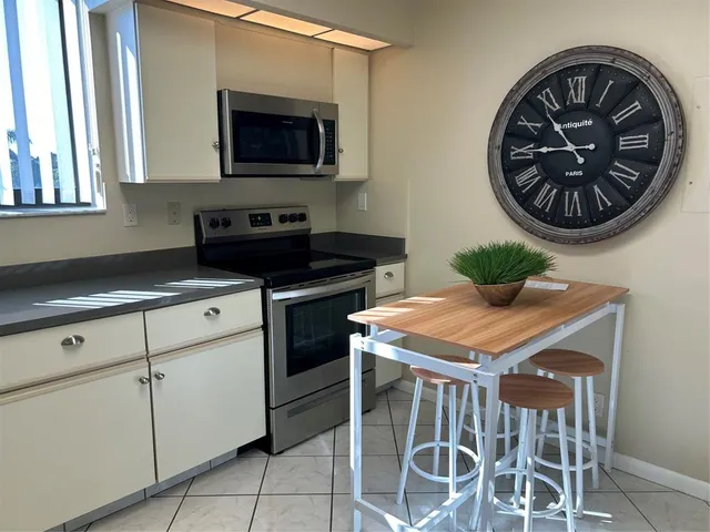 a kitchen with a stove and a microwave