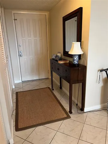 a room with a table and a mirror