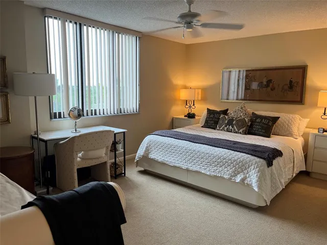 a bedroom with a bed and a table