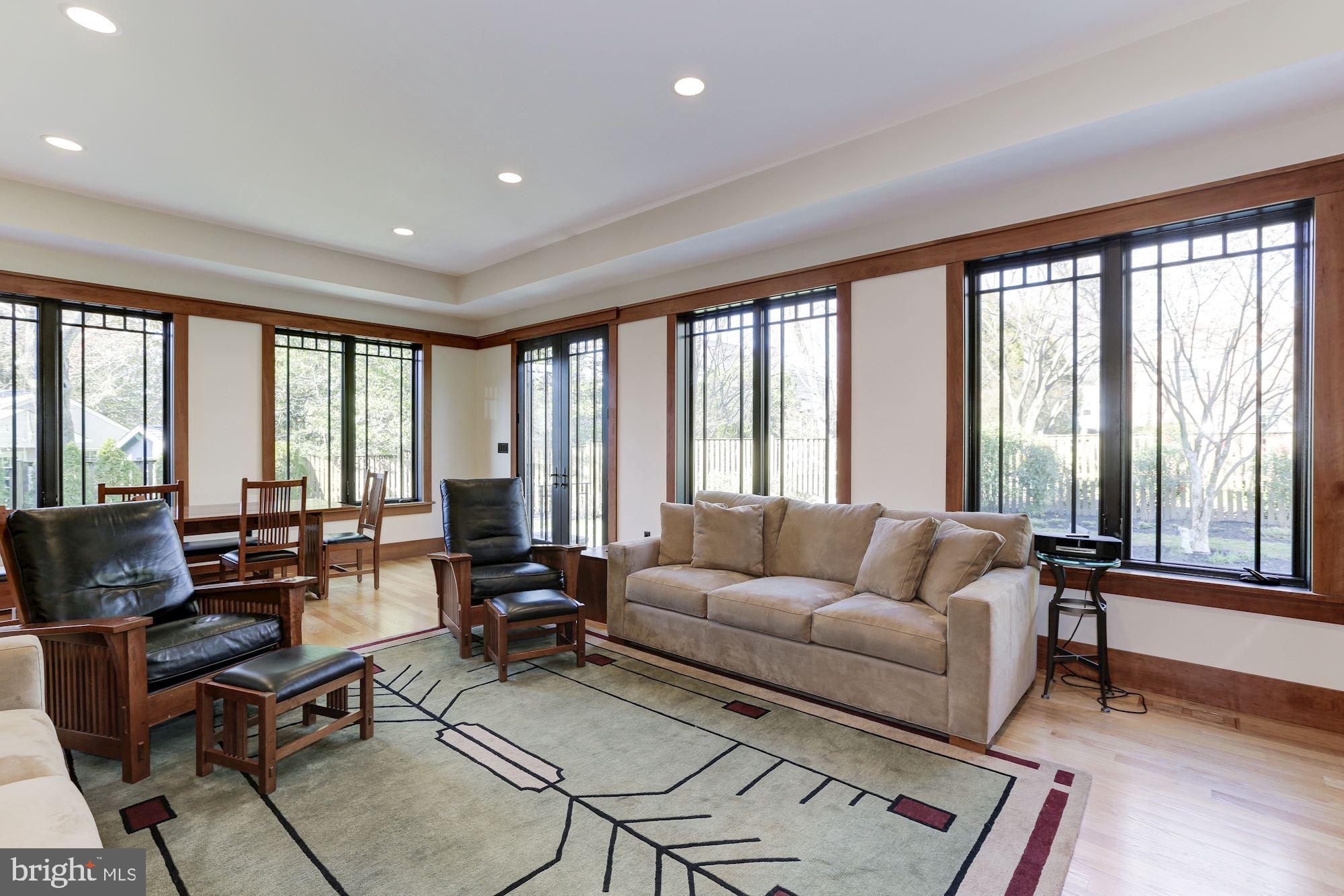 5631 Newington Road Bethesda, MD 20816 - Photo 16 of 96 Family room flooded with light from walls of glass