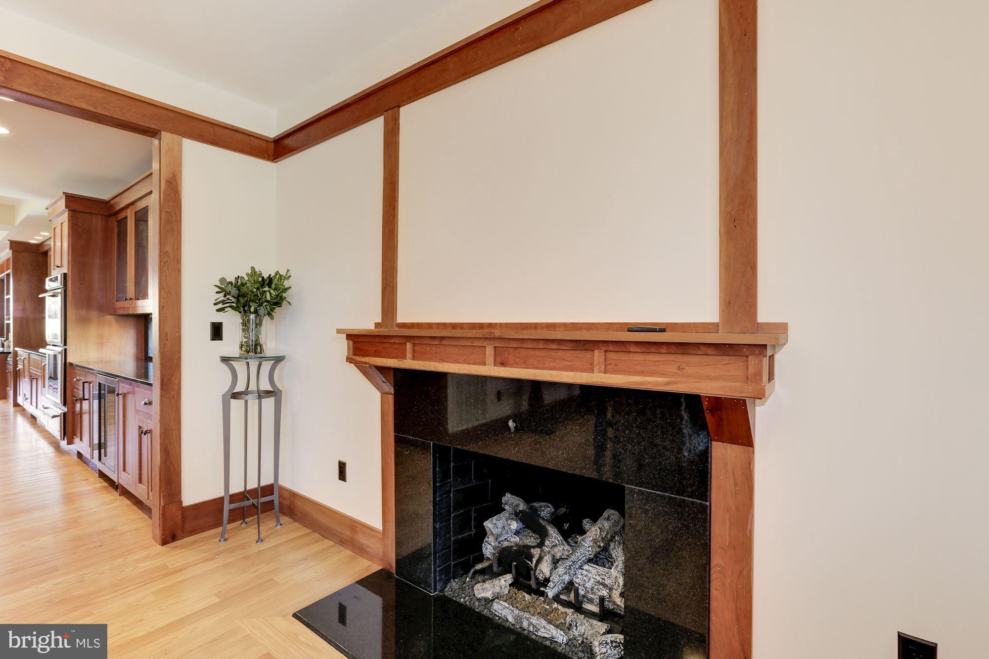 5631 Newington Road Bethesda, MD 20816 - Photo 27 of 96 Dining room gas fireplace with marble surround