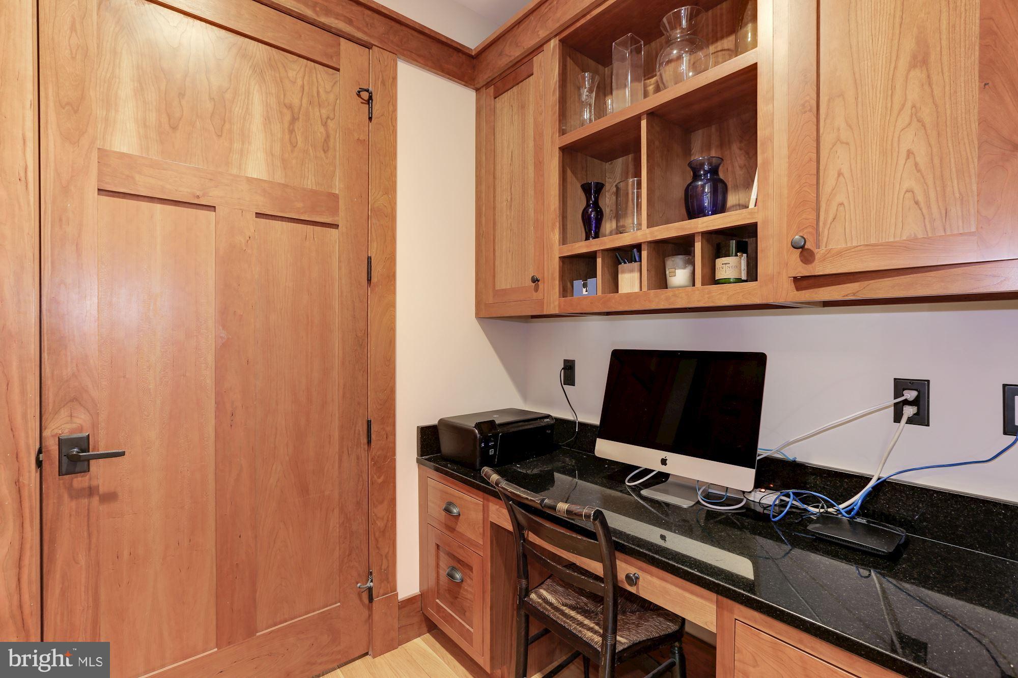 5631 Newington Road Bethesda, MD 20816 - Photo 31 of 96 Work station with custom storage entry to 1/2 bath