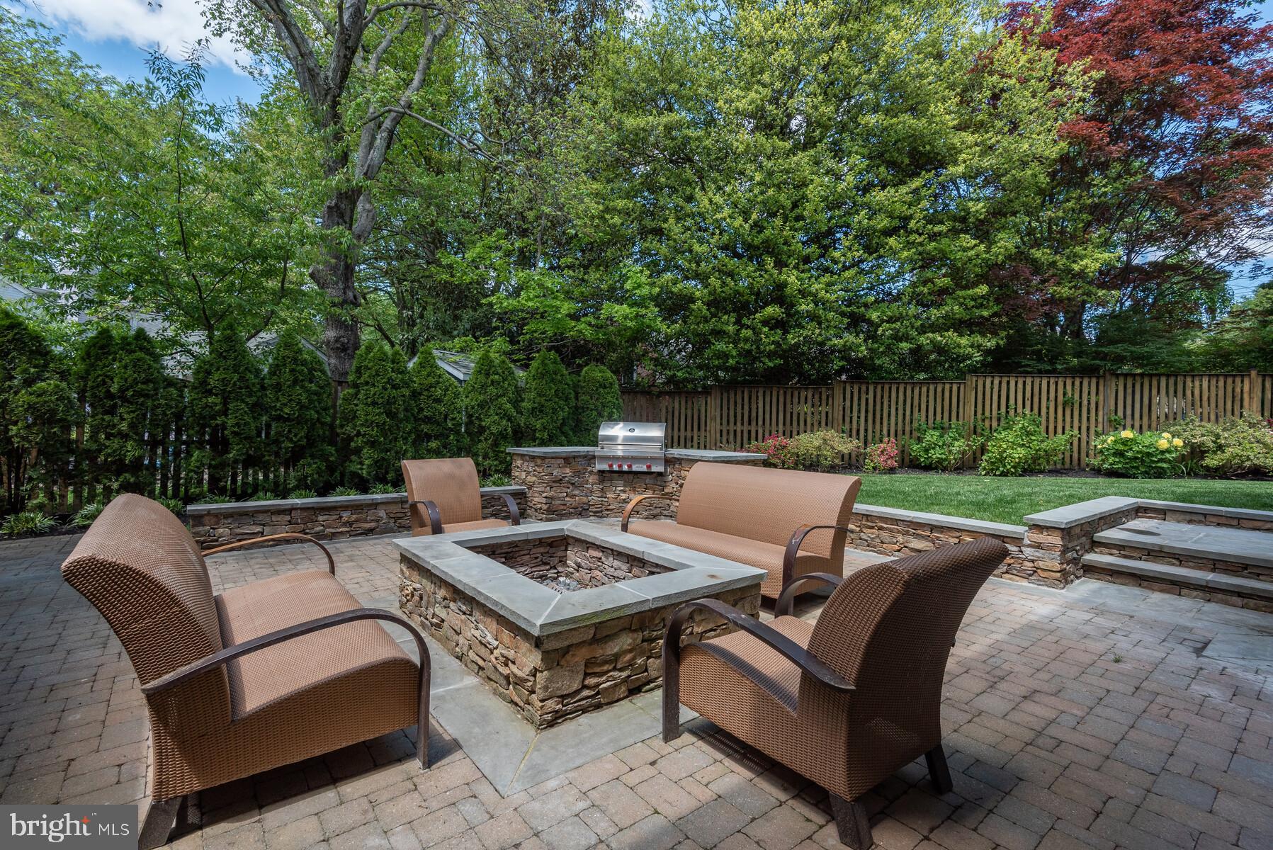 5631 Newington Road Bethesda, MD 20816 - Photo 6 of 96 Paver entertaining patio with fire pit and grill.
