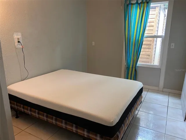 a close view of a utility room with dryer and washer