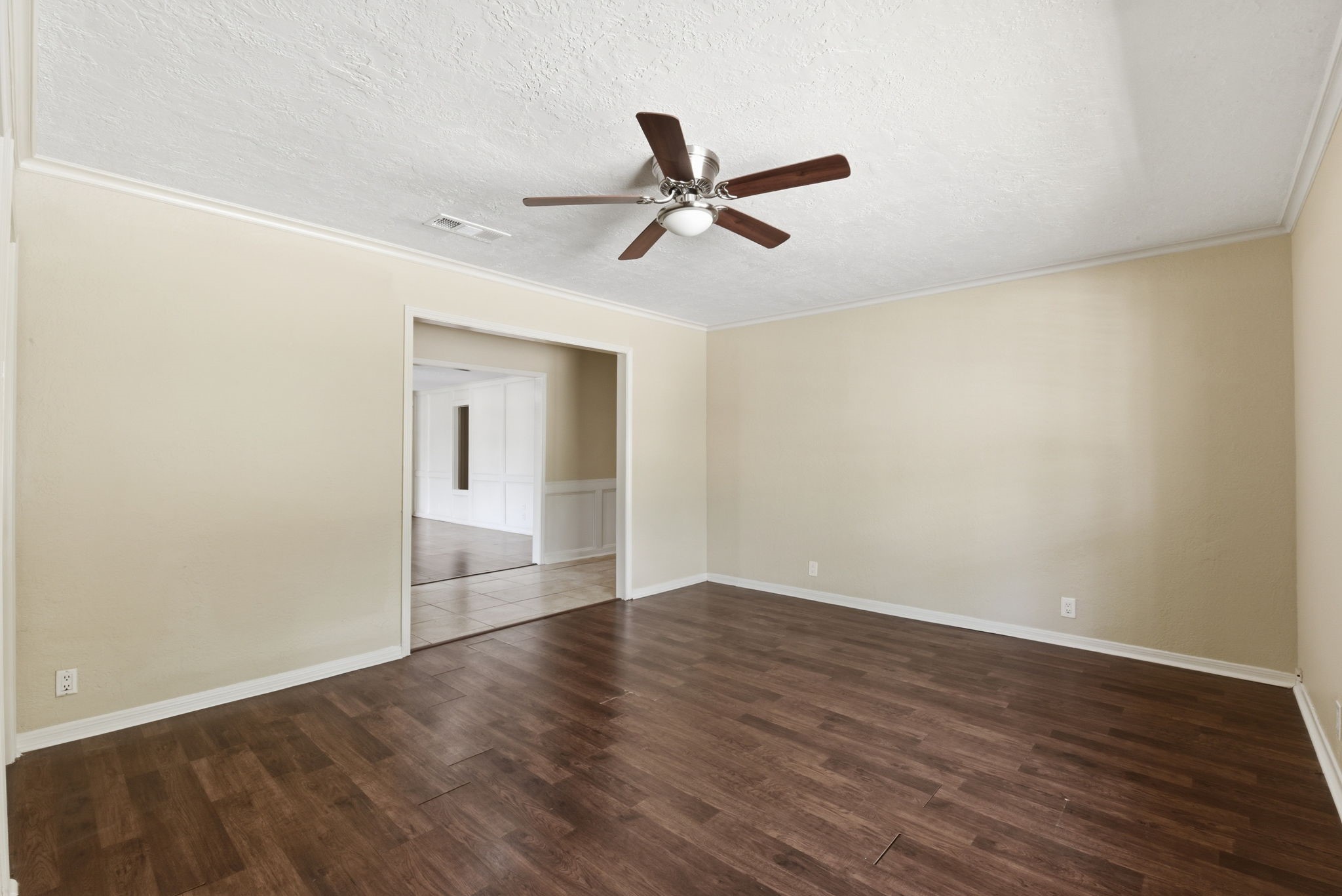 9052 Zapata Way Willis, TX 77378 - Photo 15 of 45 an empty room with wooden floor and windows