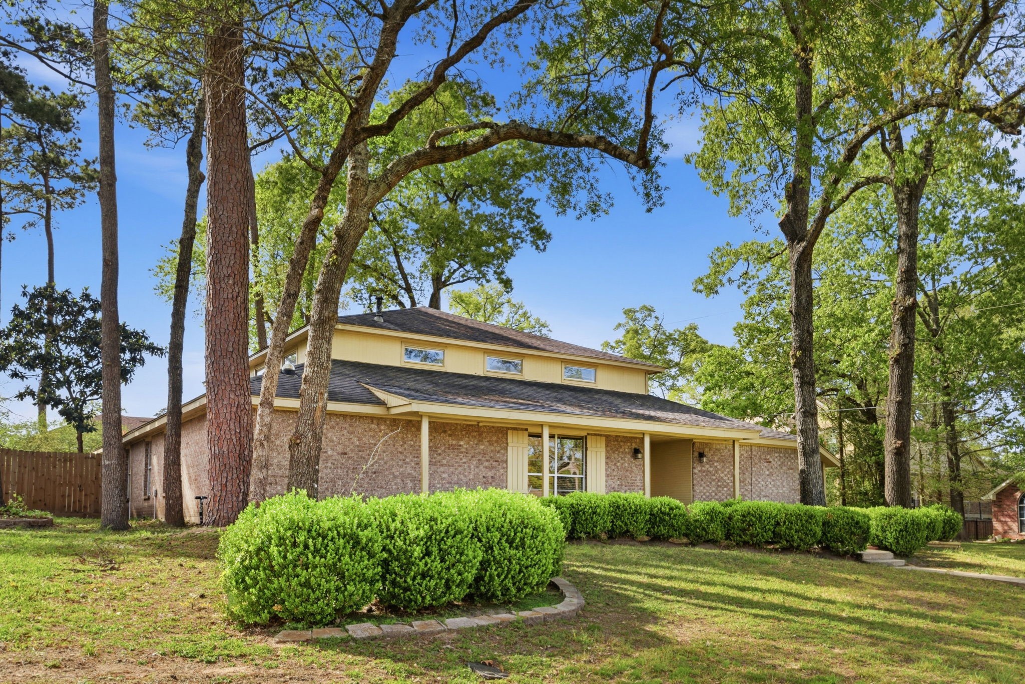 9052 Zapata Way Willis, TX 77378 - Photo 2 of 45 a view of a house with a garden