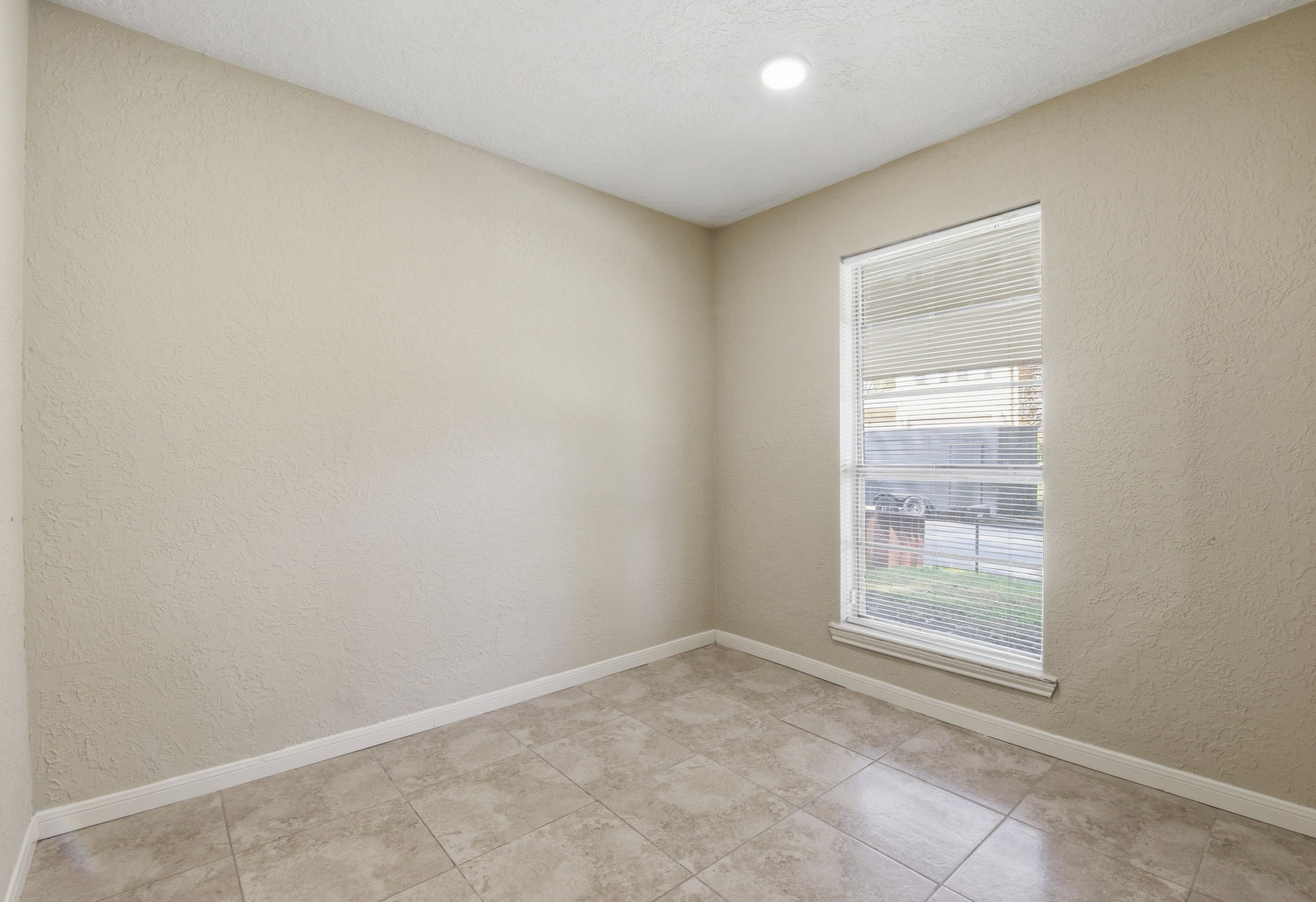 9052 Zapata Way Willis, TX 77378 - Photo 21 of 45 an empty room with windows