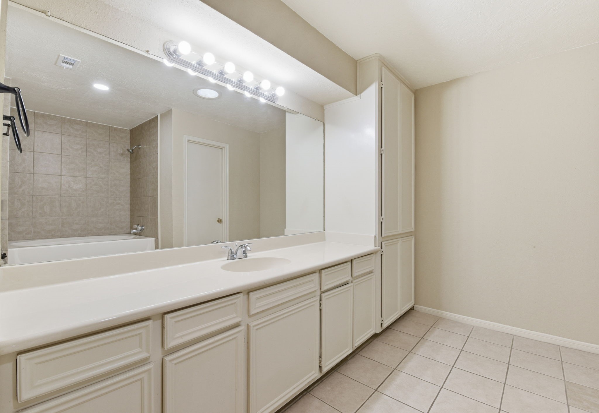 9052 Zapata Way Willis, TX 77378 - Photo 28 of 45 a bathroom with a sink and a mirror