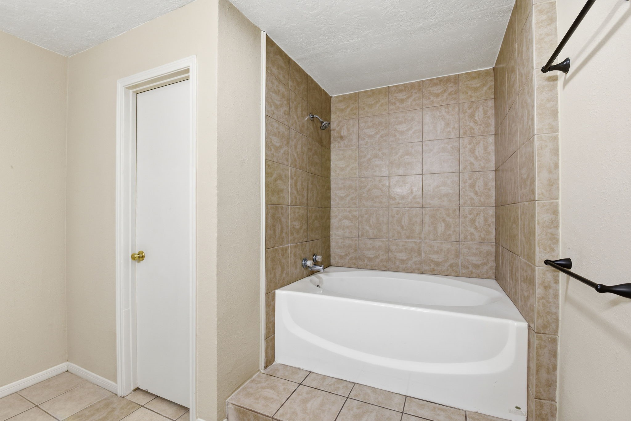 9052 Zapata Way Willis, TX 77378 - Photo 29 of 45 a white bath tub sitting next to a shower