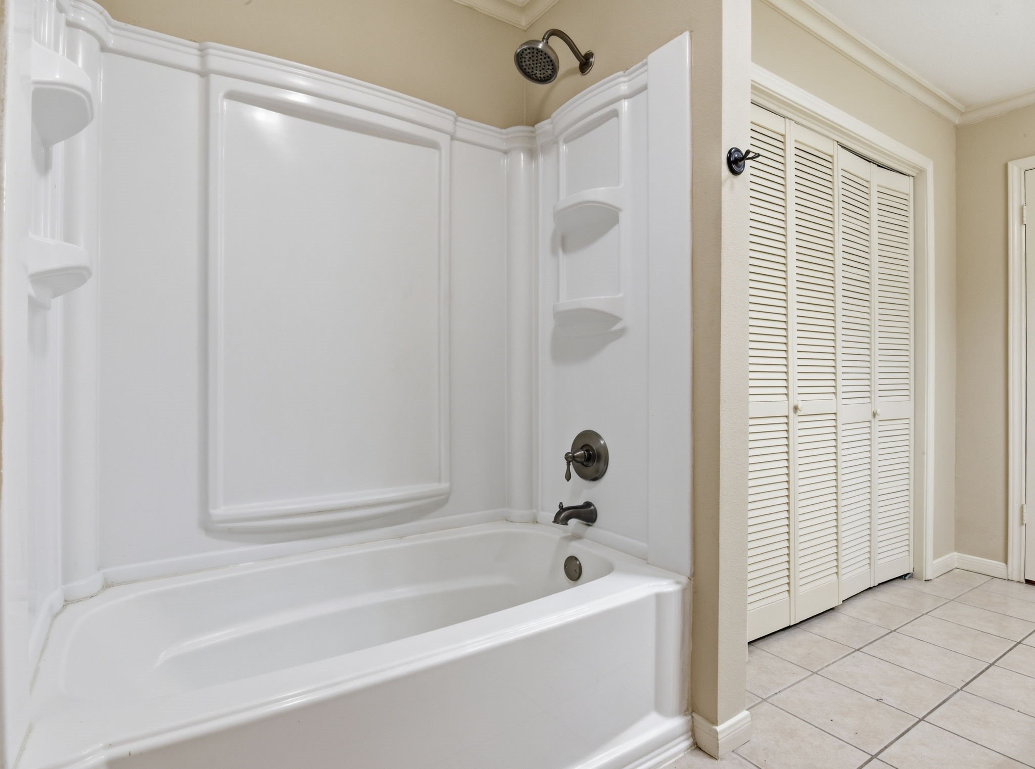9052 Zapata Way Willis, TX 77378 - Photo 33 of 45 a bathroom with a bathtub and a shower