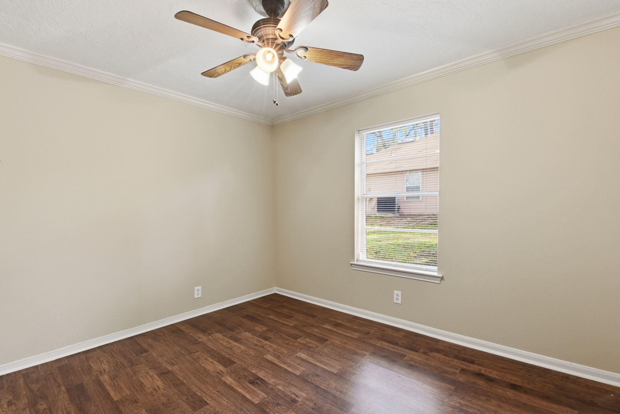 9052 Zapata Way Willis, TX 77378 - Photo 34 of 45 wooden floor in an empty room with a window