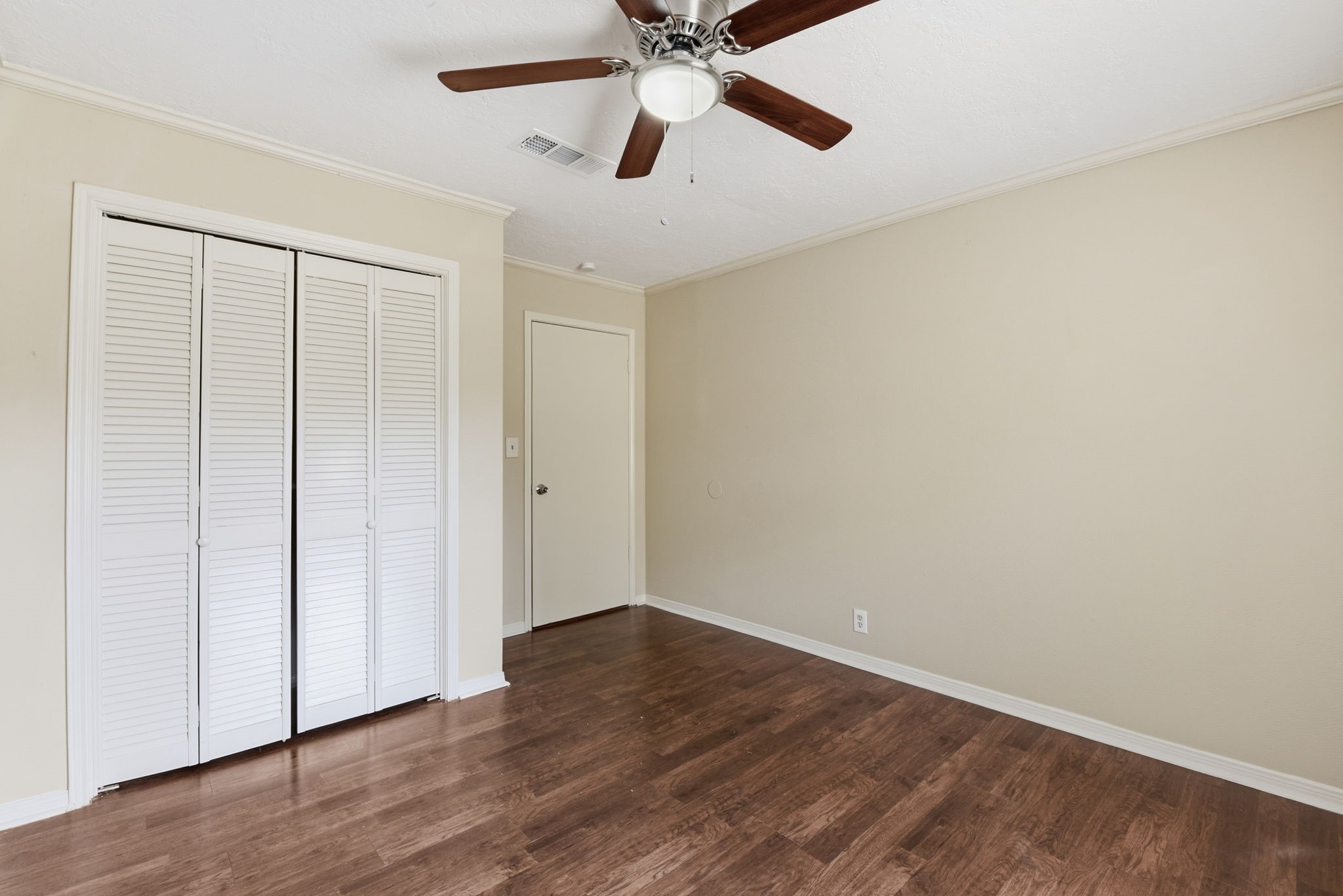 9052 Zapata Way Willis, TX 77378 - Photo 37 of 45 a view of an empty room with wooden floor